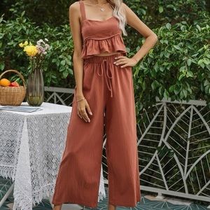 Orange ruffled crop top and wide leg pant set